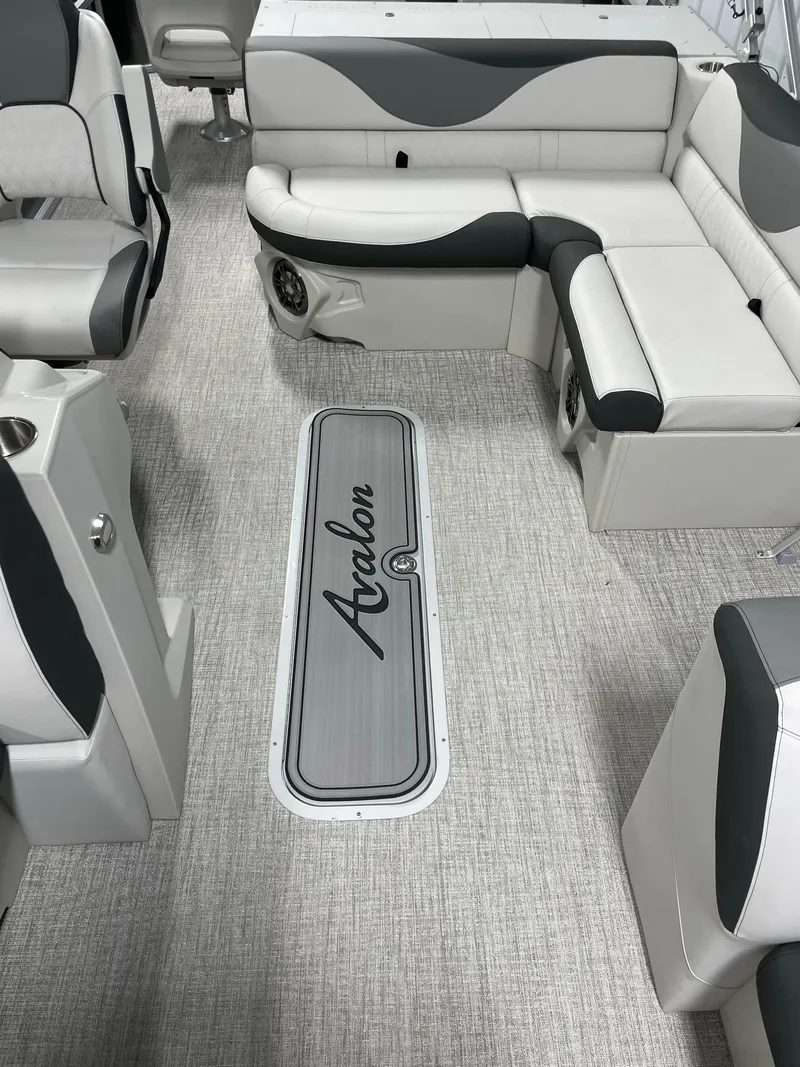 Slide: The Image of 2024 Avalon Venture 85 Rear Fish boat interior with gray and white seating. - 13