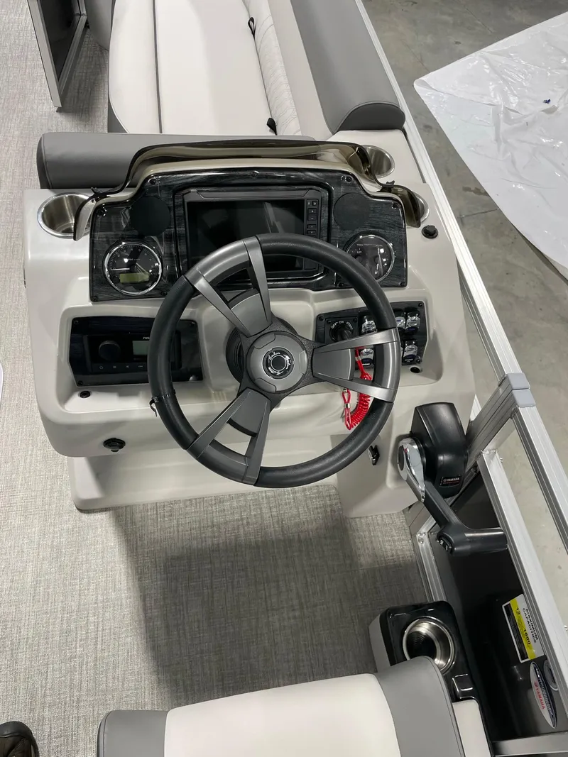 Slide: The Image of 2024 Avalon Venture 85 Rear Fish boat steering console with modern controls and comfortable seating. - 14