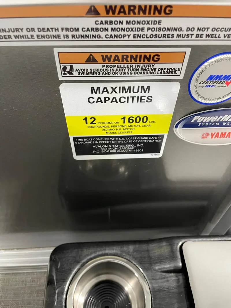 Slide: The Image of 2024 Avalon Venture 85 Rear Fish boat capacity warning labels and safety instructions. - 16