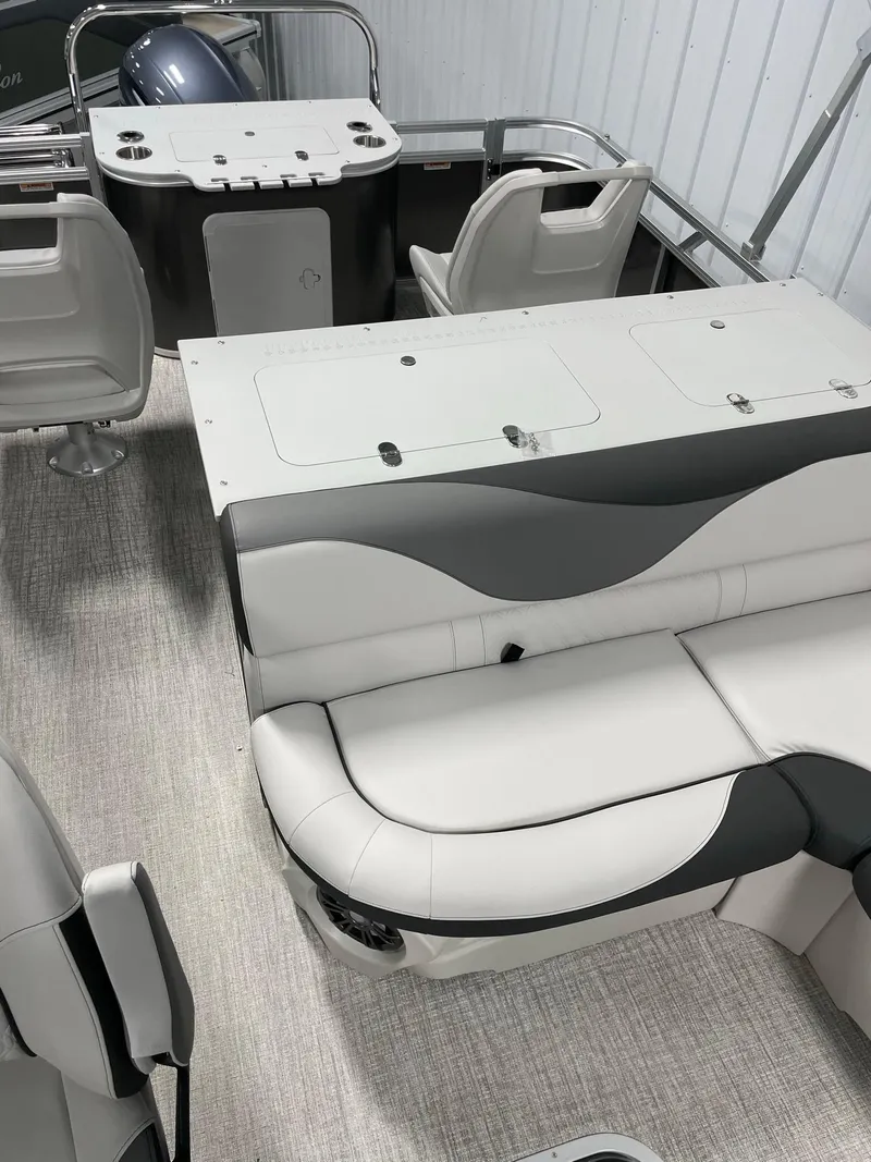 Slide: The Image of 2024 Avalon Venture 85 Rear Fish boat interior with seating and storage. - 17