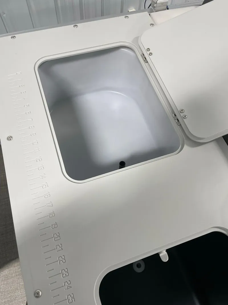 Slide: The Image of 2024 Avalon Venture 85 Rear Fish boat livewell and storage compartments. - 20