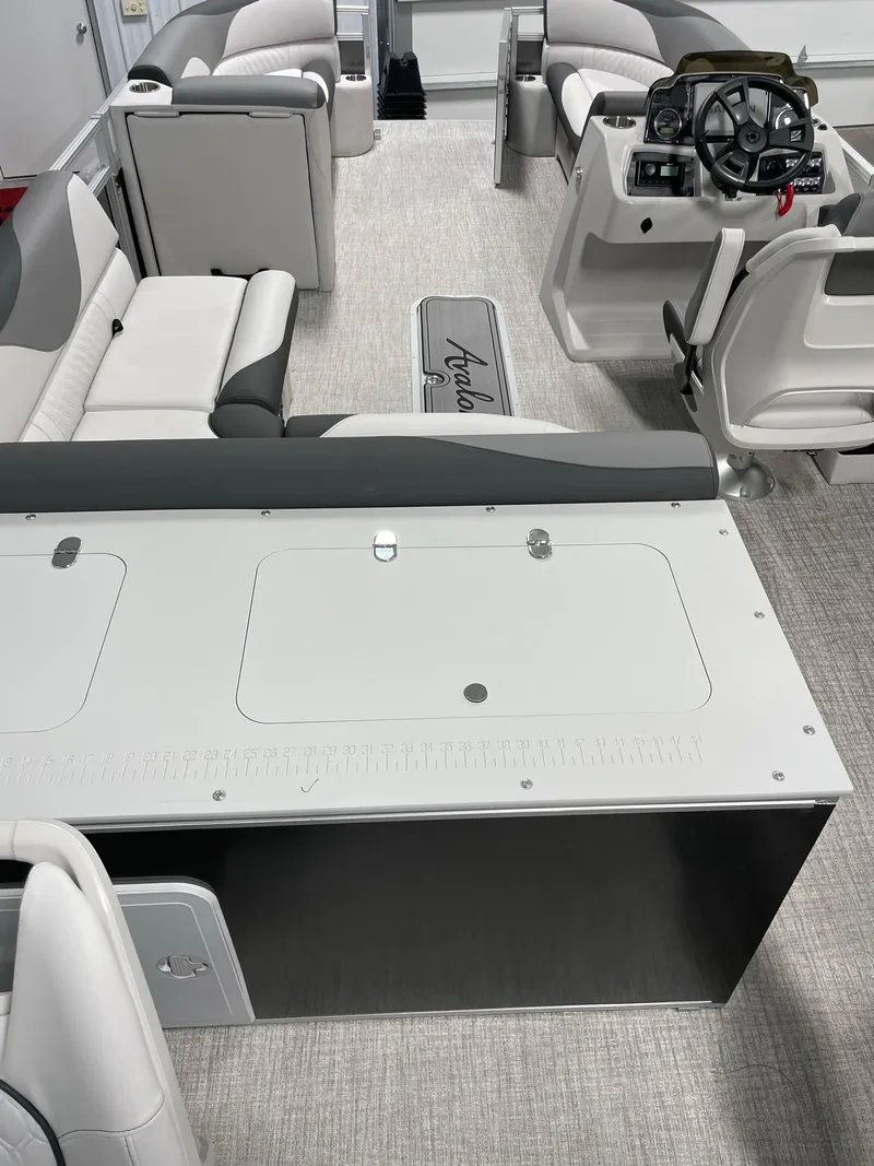 Slide: The Image of 2024 Avalon Venture 85 Rear Fish boat interior with seating and steering console. - 24