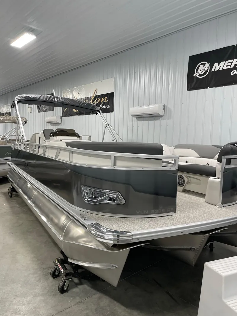 Slide: The Image of 2024 Avalon Venture 85 Rear Fish pontoon boat in showroom. - 9