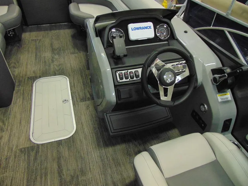 Slide: The Image of 2024 Godfrey Monaco 235 SFL iMPACT Package boat dashboard and steering wheel. - 11