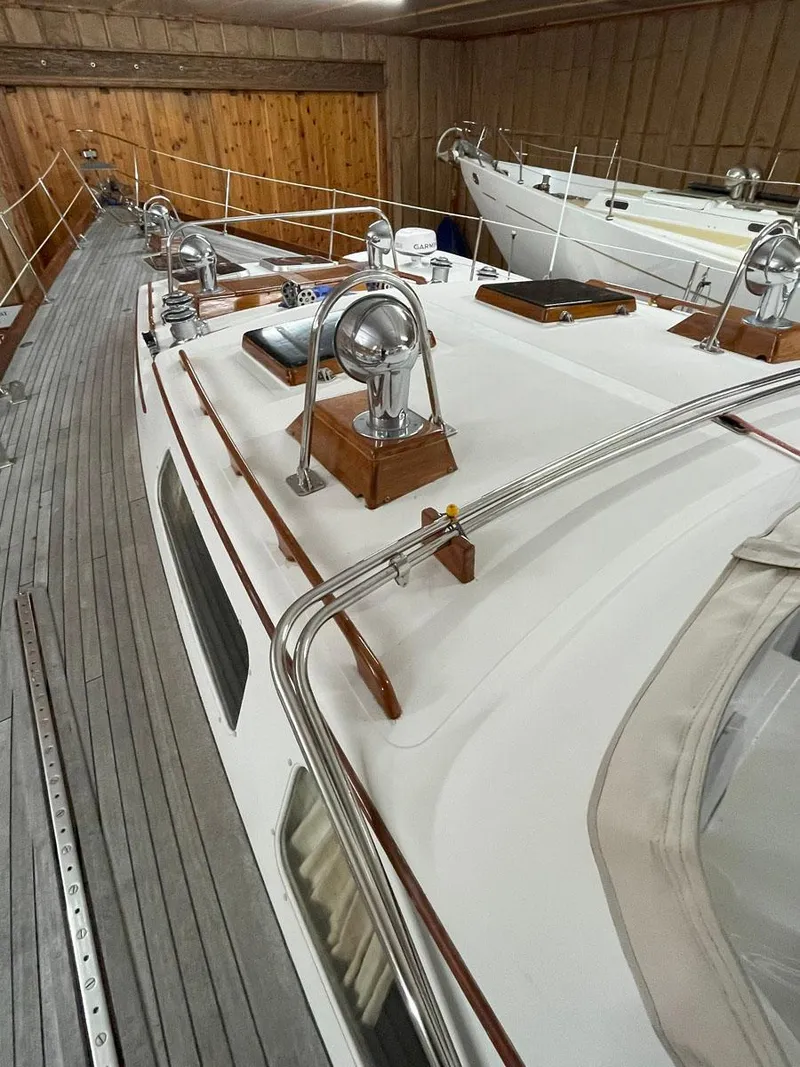 Slide: The Image of 2001 Hinckley Sou'wester 59 CC sailboat in indoor storage, showcasing deck and winches. - 10