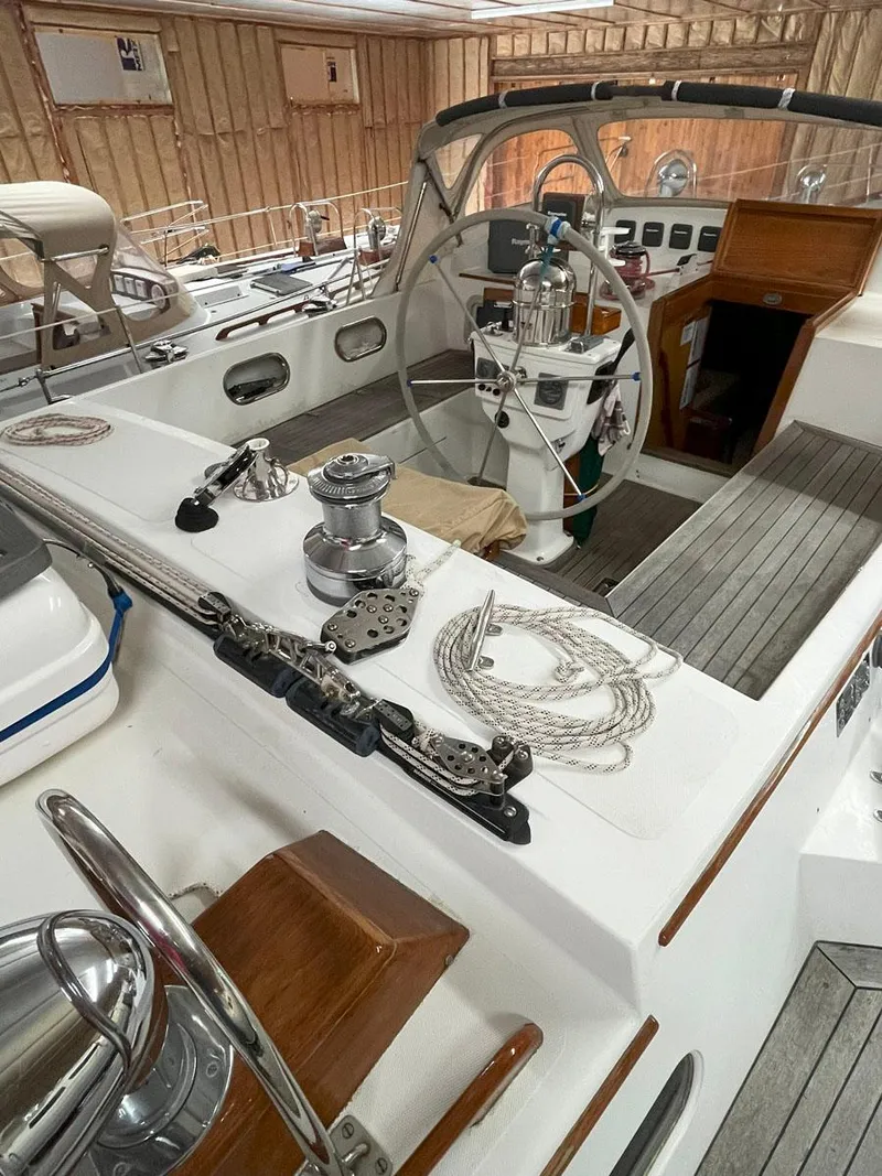 Slide: The Image of 2001 Hinckley Sou'wester 59 CC sailboat cockpit with steering wheel and winches. - 14