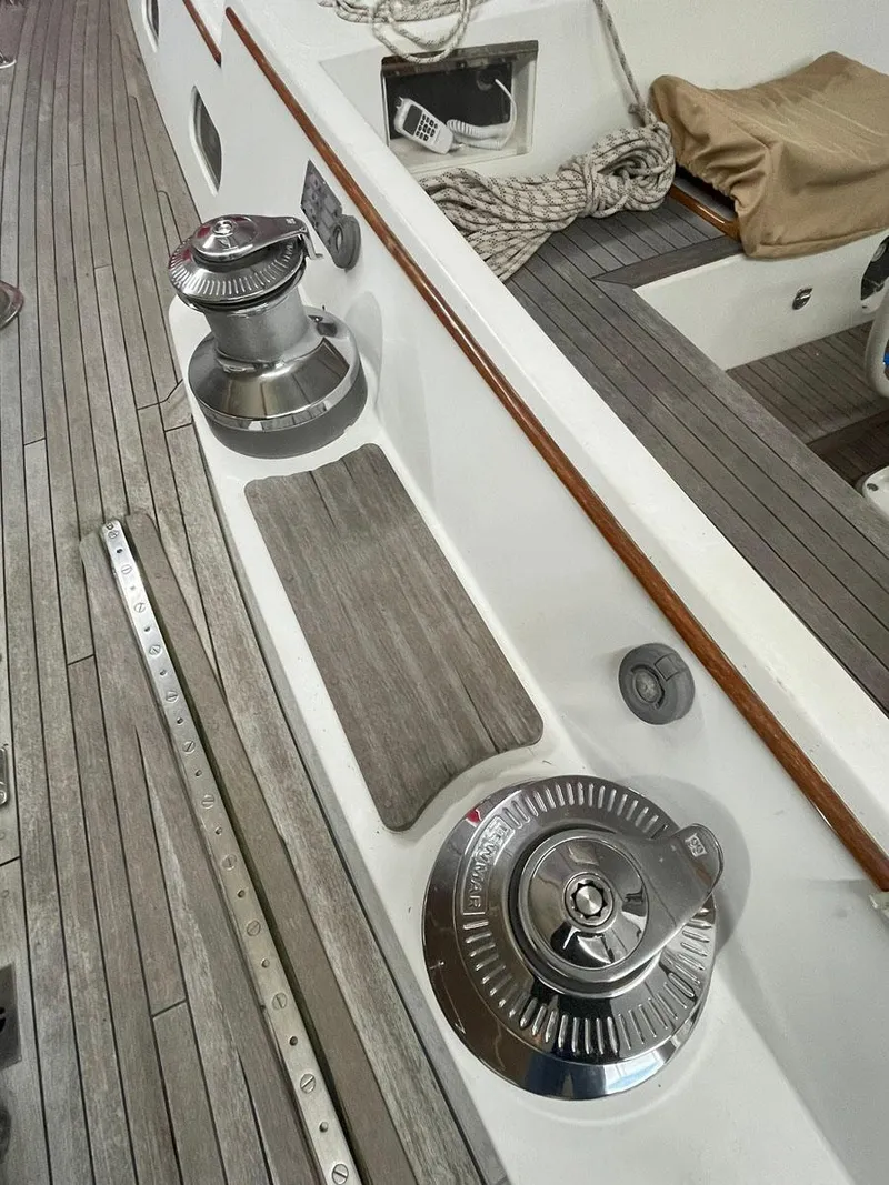 Slide: The Image of Deck of 2001 Hinckley Sou'wester 59 CC sailboat with winches and teak flooring. - 15