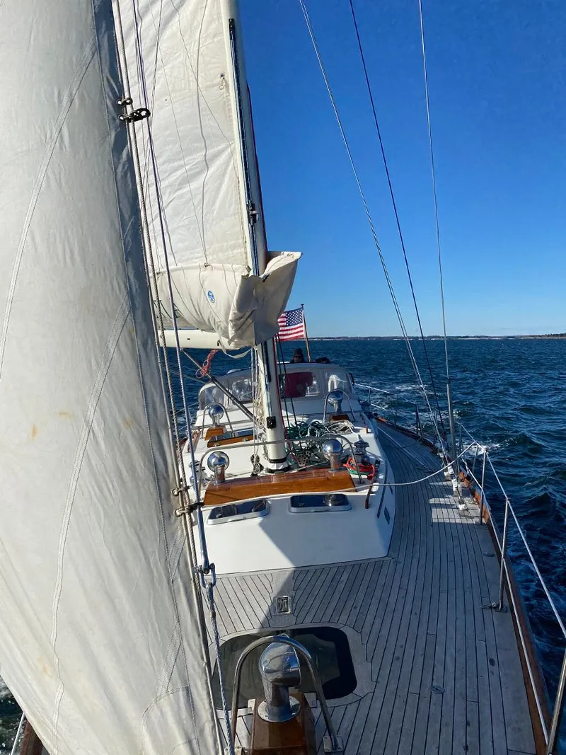 Slide: The Image of Sailing on a 2001 Hinckley Sou'wester 59 CC yacht with clear blue skies. - 3