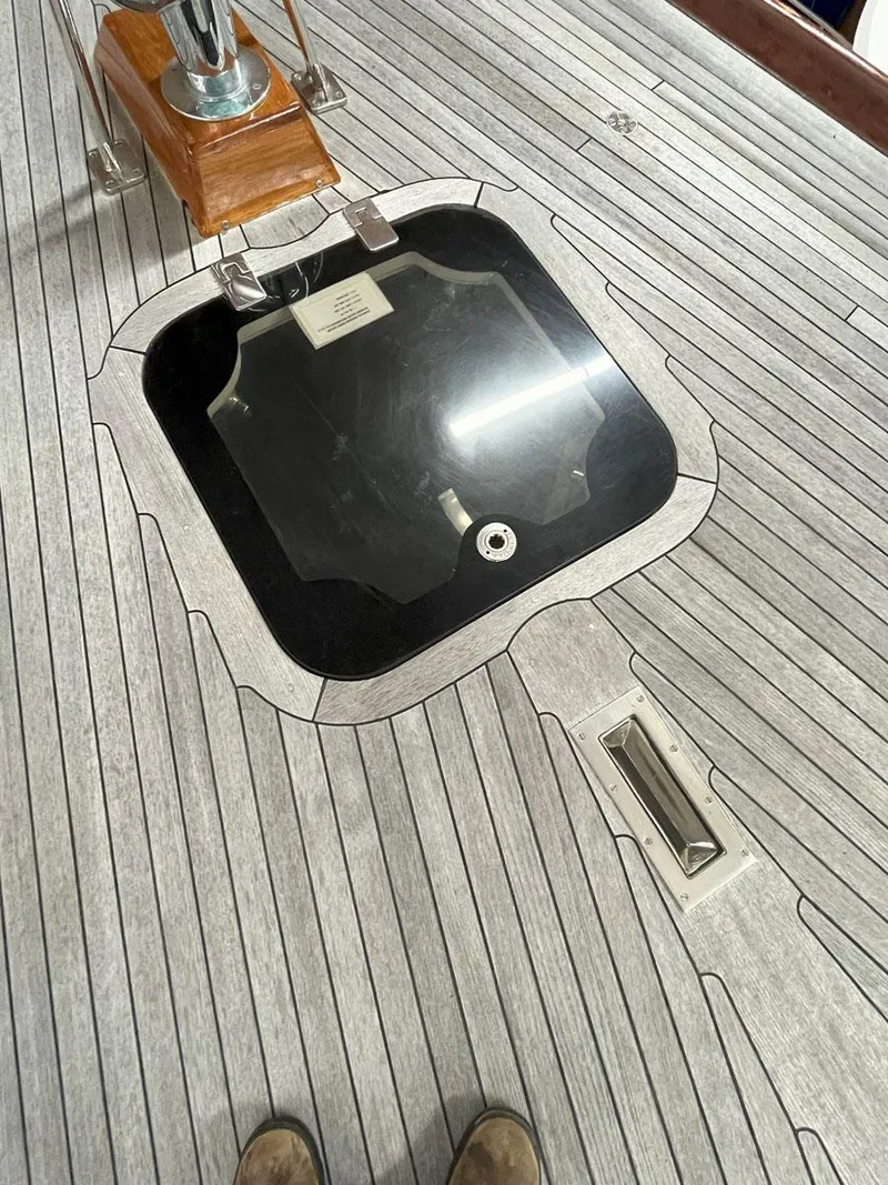 Slide: The Image of Teak deck of 2001 Hinckley Sou'wester 59 CC sailboat with hatch and fittings. - 6