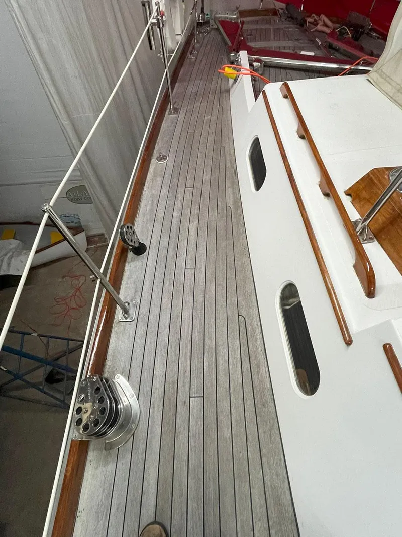 Slide: The Image of Hinckley Sou'wester 59 CC 2001 yacht deck with wooden finish and railing. - 11