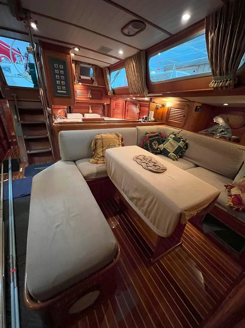 Slide: The Image of Luxurious interior of 2001 Hinckley Sou'wester 59 CC yacht with elegant seating and wooden finishes. - 25