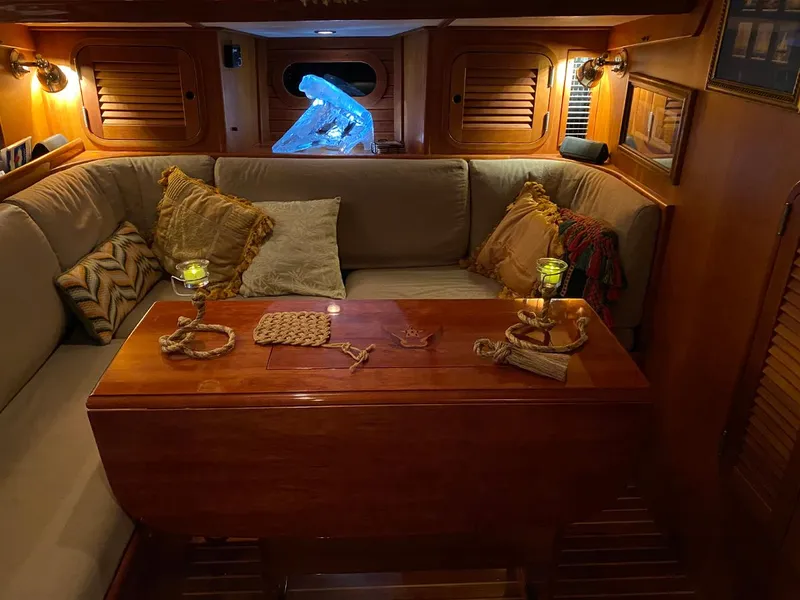 Slide: The Image of Luxurious 2001 Hinckley Sou'wester 59 CC yacht interior with cozy seating and elegant decor. - 26