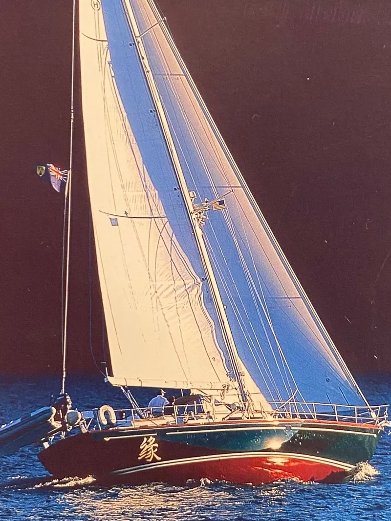 Slide: The Image of Hinckley Sou'wester 59 CC sailboat from 2001, sailing on open water with full sails. - 4