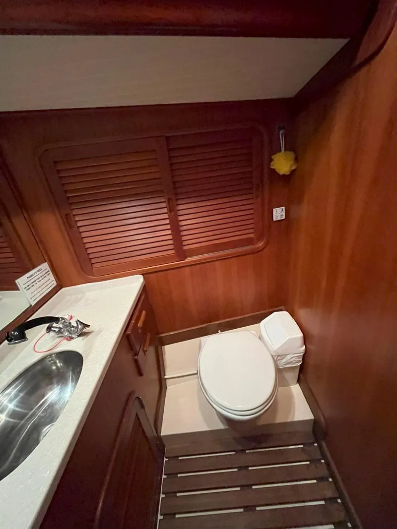 Slide: The Image of Hinckley Sou'wester 59 CC 2001 yacht bathroom with wooden interior and modern fixtures. - 41