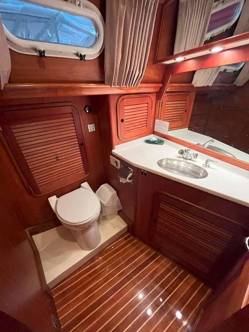 Slide: The Image of Luxurious 2001 Hinckley Sou'wester 59 CC yacht bathroom with wood accents and modern fixtures. - 42
