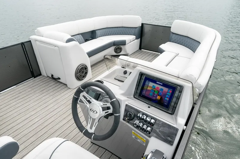 Slide: The Image of 2023 Harris 250 Sunliner Sport boat interior with modern dashboard and spacious seating. - 16
