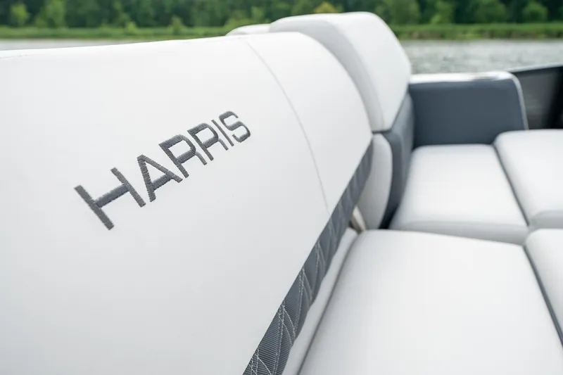 Slide: The Image of 2023 Harris 250 Sunliner Sport boat with luxurious white seating. - 22