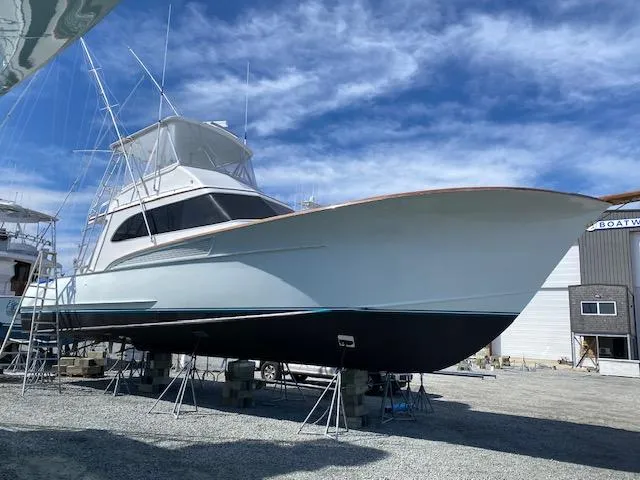 Slide: The Image of 1984 Custom Carolina Buddy Davis boat docked at a marina. - 1