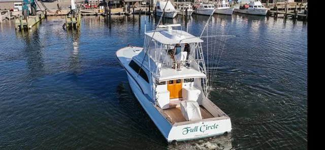 Slide: The Image of 1984 Custom Carolina Buddy Davis boat in a marina. - 12