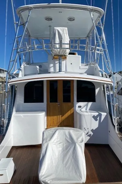 Slide: The Image of 1984 Custom Carolina Buddy Davis boat with covered seating and wooden doors. - 15