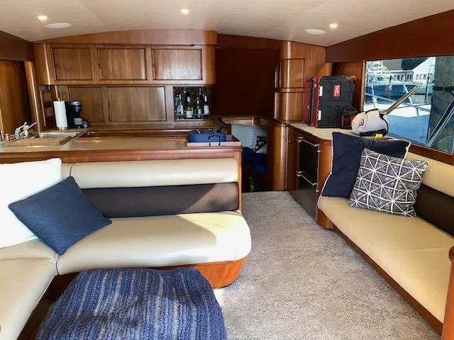 Slide: The Image of Interior of 1984 Custom Carolina Buddy Davis yacht with wooden cabinetry and cozy seating. - 16
