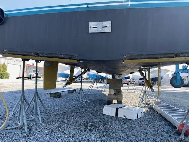 Slide: The Image of 1984 Custom Carolina Buddy Davis boat on stands for maintenance. - 17