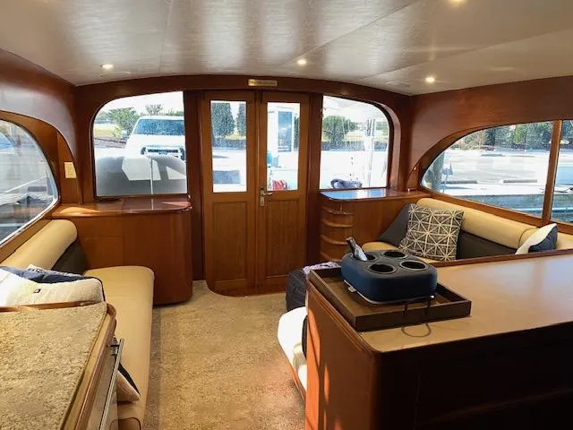 Slide: The Image of Interior of 1984 Custom Carolina Buddy Davis yacht with wooden finishes and large windows. - 21