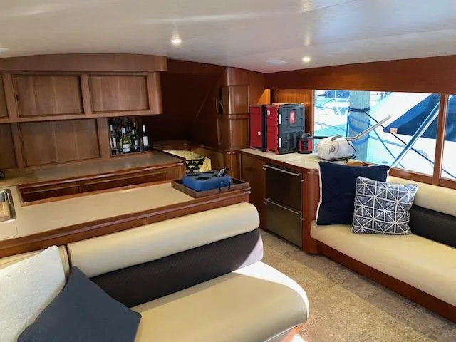 Slide: The Image of Interior of 1984 Custom Carolina Buddy Davis yacht with seating, kitchen, and bar area. - 26