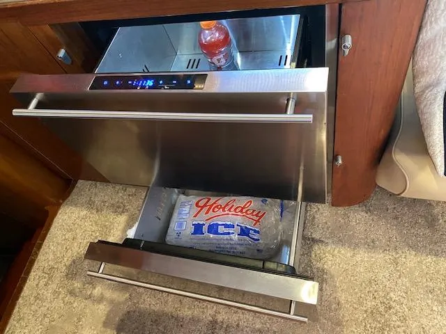 Slide: The Image of Stainless steel refrigerator drawers on a 1984 Custom Carolina Buddy Davis boat. - 28