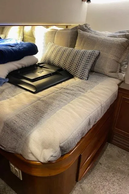 Slide: The Image of Cozy bedroom in a 1984 Custom Carolina Buddy Davis boat with plush bedding. - 33