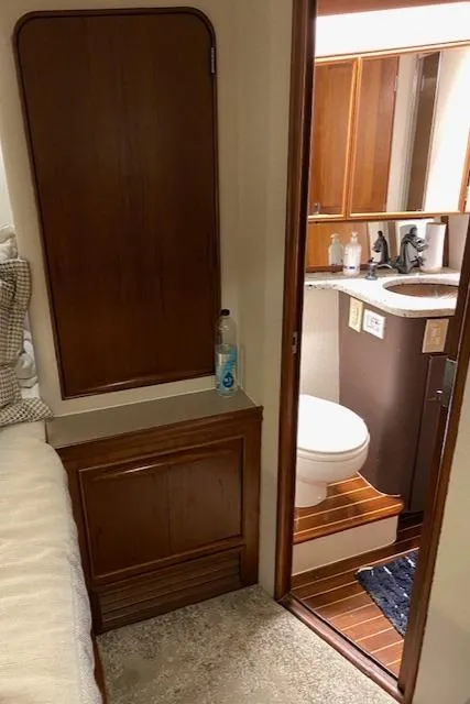 Slide: The Image of 1984 Custom Carolina Buddy Davis yacht interior with bathroom and wooden cabinetry. - 34