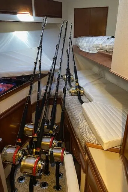 Slide: The Image of Fishing rods in cabin of 1984 Custom Carolina Buddy Davis boat. - 37