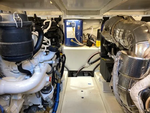 Slide: The Image of 1984 Custom Carolina Buddy Davis engine room with dual engines and equipment. - 41