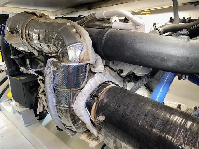 Slide: The Image of Engine room of a 1984 Custom Carolina Buddy Davis boat showing insulated exhaust system. - 42