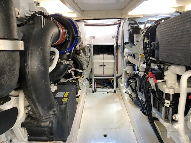 Slide: The Image of Engine room of a 1984 Custom Carolina Buddy Davis boat with visible machinery. - 46