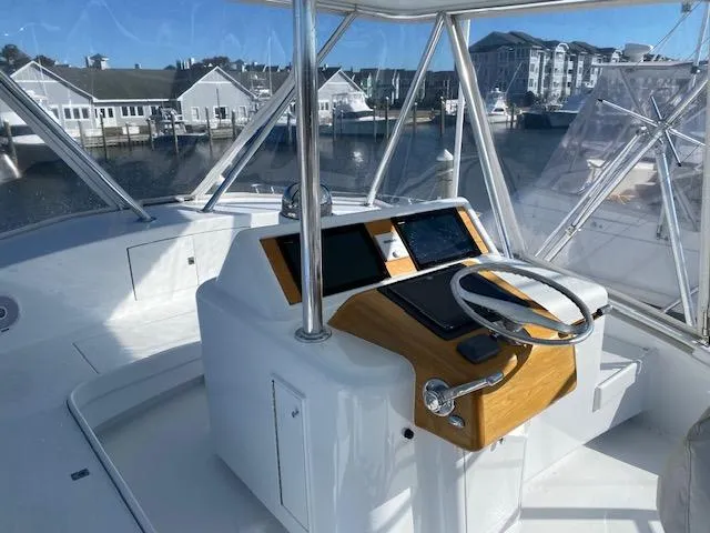 Slide: The Image of 1984 Custom Carolina Buddy Davis boat helm with modern navigation equipment. - 49