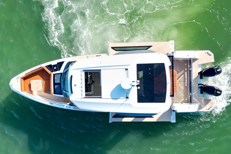 Slide: The Image of Aerial view of 2026 Saxdor 400 GTC yacht cruising on green water. - 10