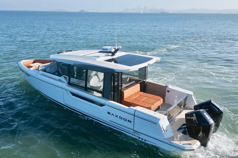 Slide: The Image of 2026 Saxdor 400 GTC luxury motorboat cruising on open water. - 11