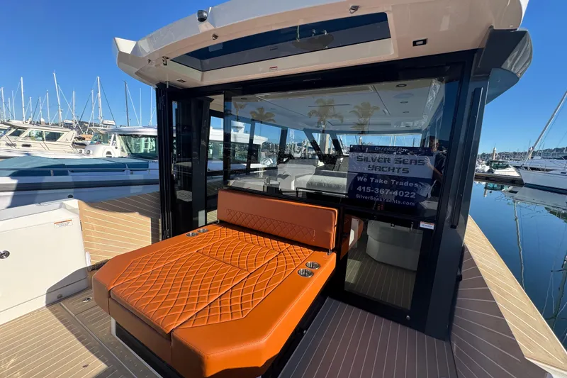 Slide: The Image of 2026 Saxdor 400 GTC yacht with luxurious seating at marina. - 25