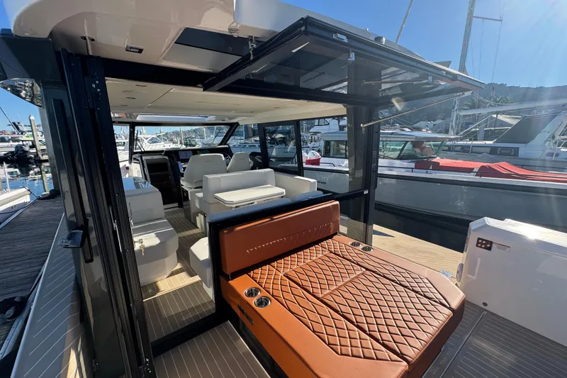 Slide: The Image of 2026 Saxdor 400 GTC luxury yacht interior with modern seating and sleek design. - 27