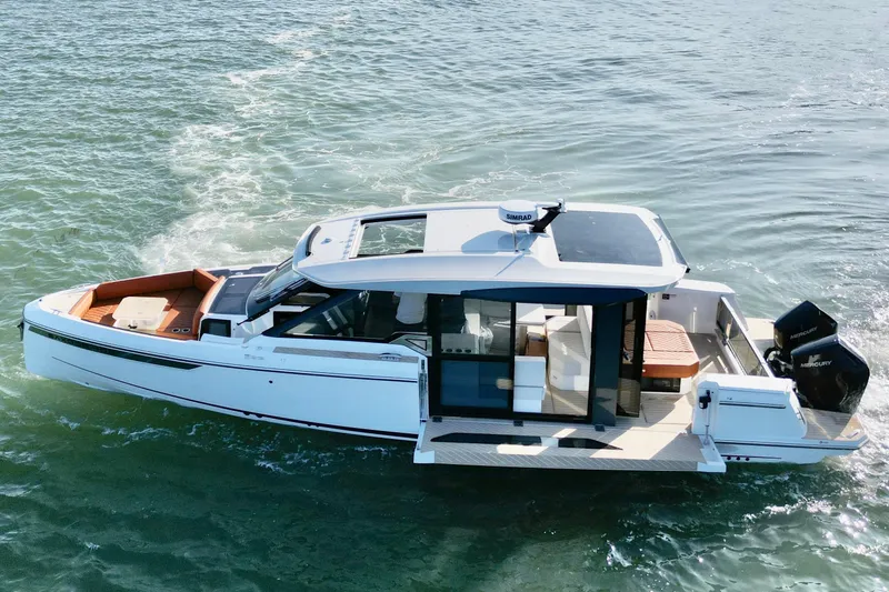 Slide: The Image of 2026 Saxdor 400 GTC boat cruising on water, showcasing sleek design and modern features. - 30