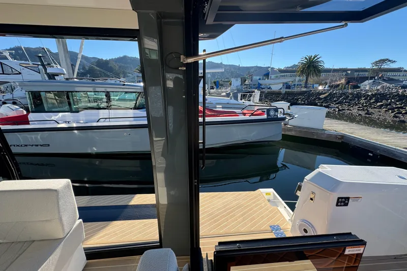 Slide: The Image of 2026 Saxdor 400 GTC yacht docked at marina, viewed from interior. - 32