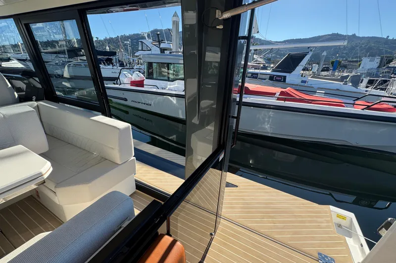 Slide: The Image of 2026 Saxdor 400 GTC interior with marina view, featuring sleek design and comfortable seating. - 33