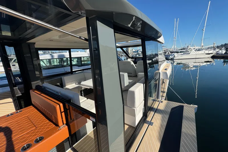 Slide: The Image of 2026 Saxdor 400 GTC luxury yacht interior with modern seating, docked at marina. - 34