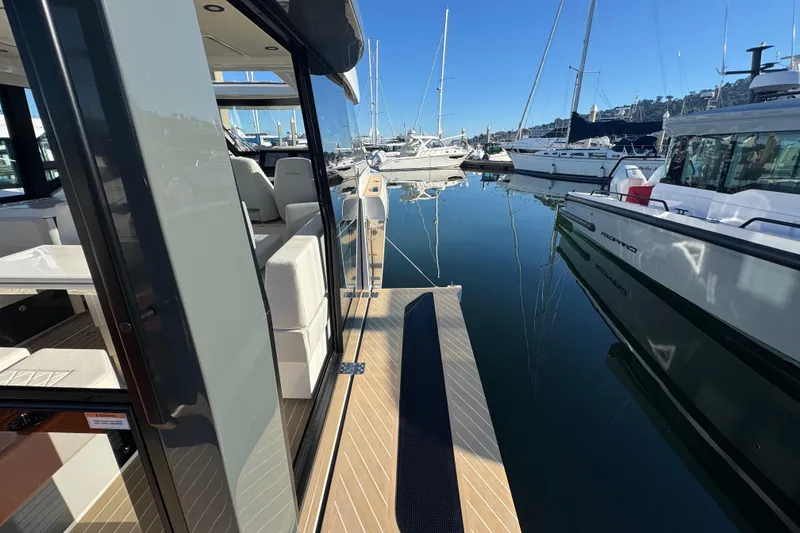 Slide: The Image of Saxdor 400 GTC 2026 yacht docked at marina, showcasing sleek design and luxurious interior. - 35