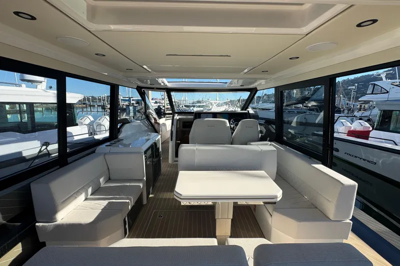 Slide: The Image of Interior of 2026 Saxdor 400 GTC yacht, featuring modern seating and panoramic windows. - 38