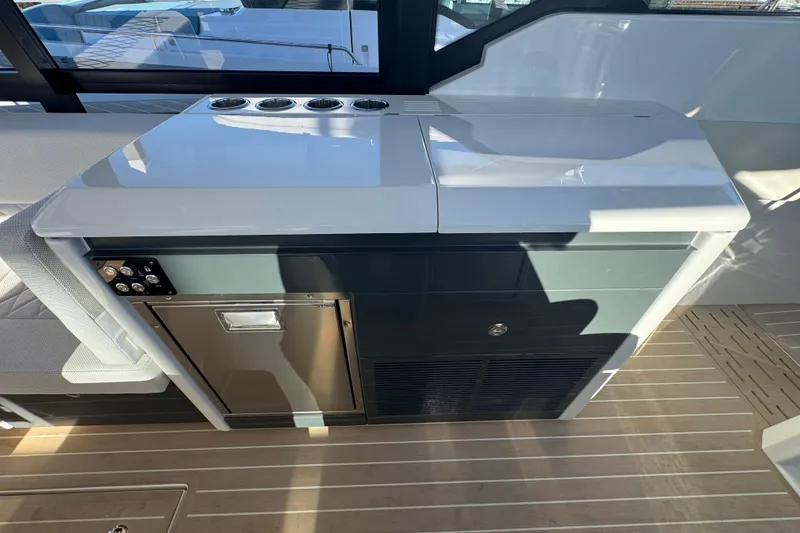 Slide: The Image of Interior of 2026 Saxdor 400 GTC yacht featuring a sleek kitchenette design. - 40