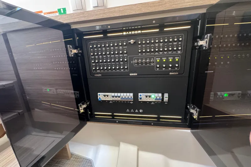 Slide: The Image of Electrical control panel inside 2026 Saxdor 400 GTC boat, featuring advanced switches and indicators. - 47