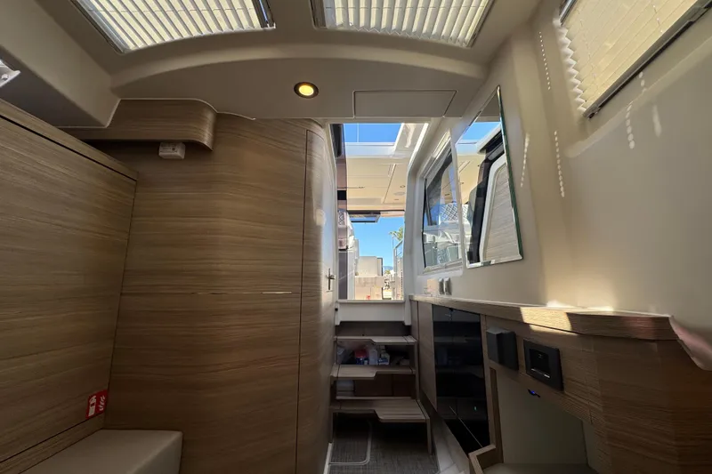 Slide: The Image of Interior of 2026 Saxdor 400 GTC boat, featuring modern wood finishes and ample natural light. - 48