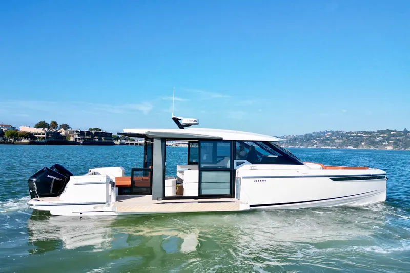 Slide: The Image of 2026 Saxdor 400 GTC boat cruising on a sunny day, showcasing sleek design and modern features. - 5